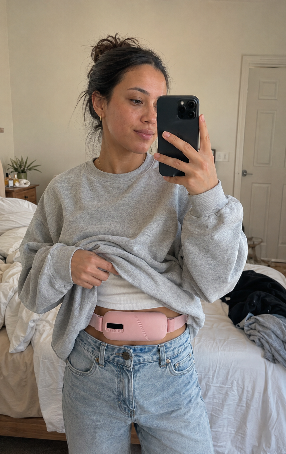 MIRA held flat against the lower abdomen under clothing